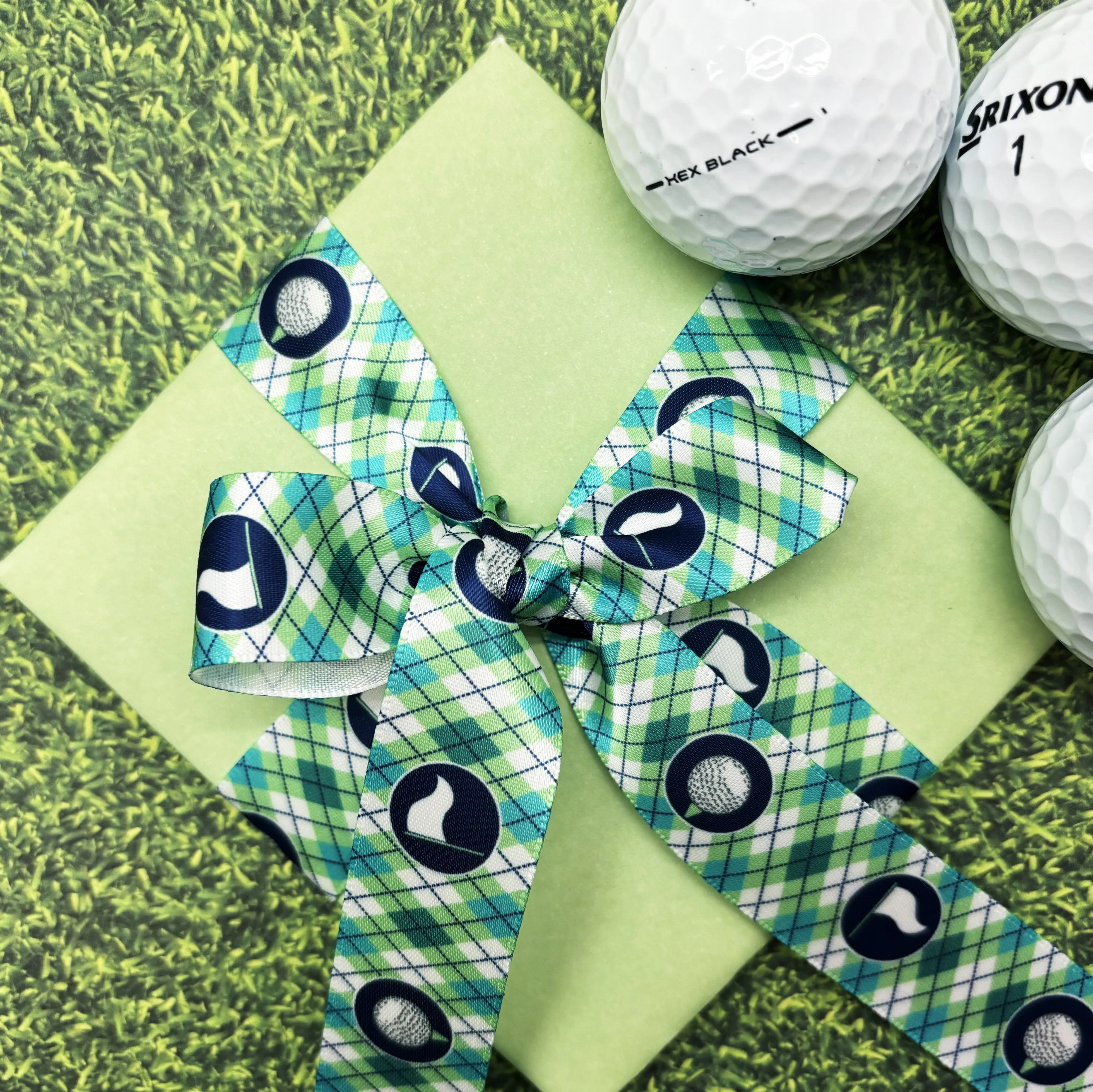 Golf ribbon golf balls and tees and golf flags in an argyle background in pink or blue printed on 7/8" white satin